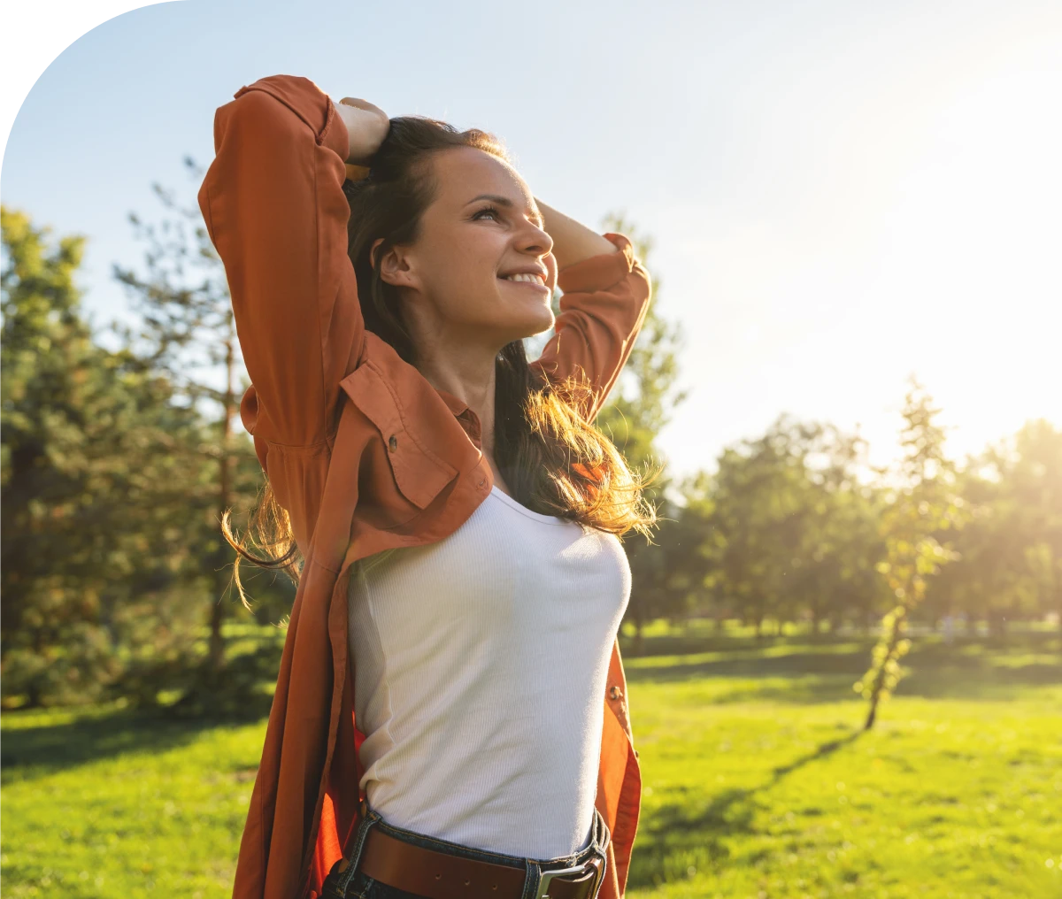 Woman enjoying sunlight in a park